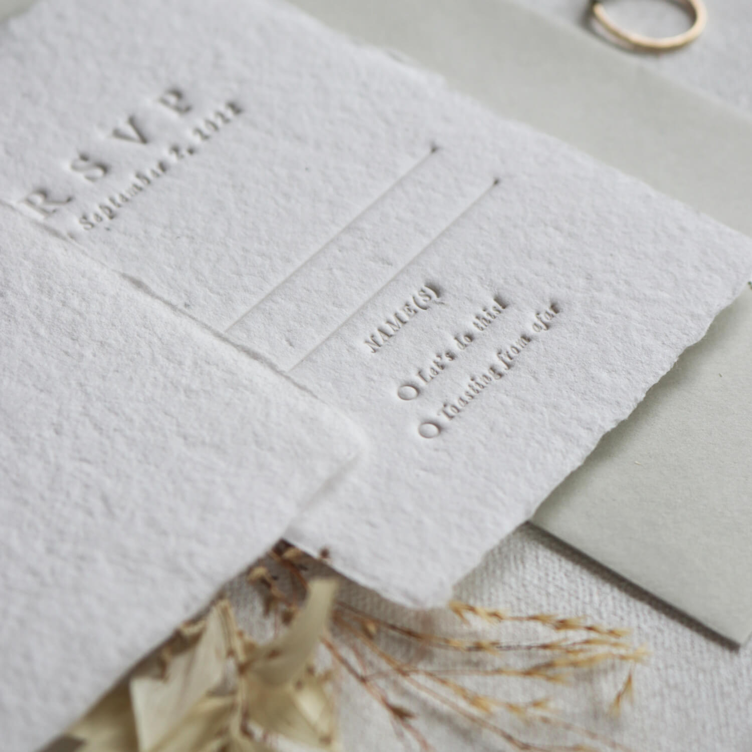 letterpress printed RSVP cards on seeded handmade paper