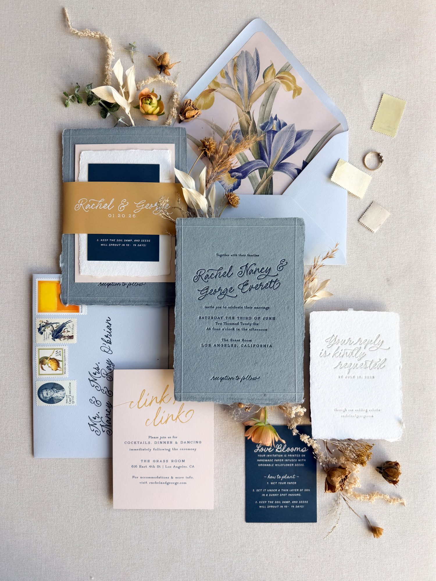 Vintage inspired wedding invitation suite with blue handmade paper and letterpress printing.